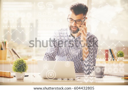 Cheerful businessman at workplace using laptop and talking on home. Image with abstract digital pattern. Communication concept
