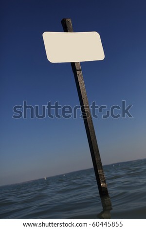Blank notice board in the water