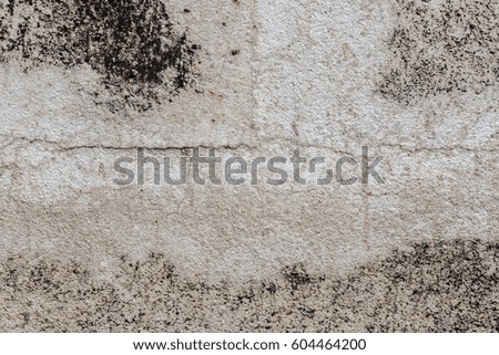 Old cracked plaster on the wall. Grunge concrete texture. Grunge stucco background. Retro texture. Vintage texture. Distress Texture. Scratched wall pattern