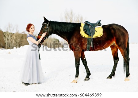Girl with horse in winter photo shoot