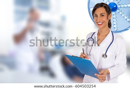 Portrait of attractive young female doctor. Hospital theme.