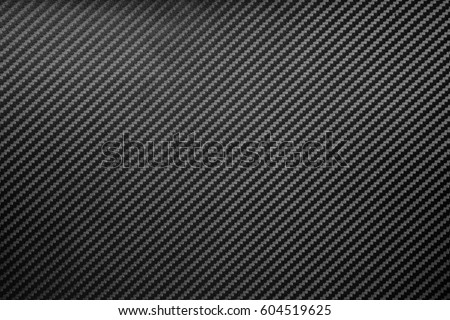 Carbon fiber composite raw material background Royalty-Free Stock Photo #604519625