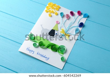 Fancy gift card on blue wooden background