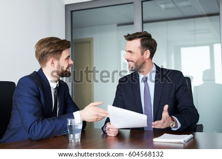 job interview - happy recruiter talking with candidate