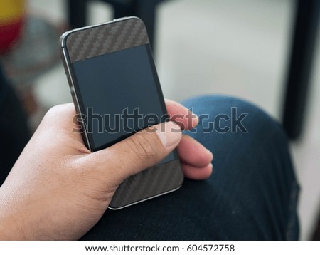 Asian man holding phone relax time