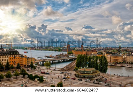 Scenic aerial view of Gamla Stan - Old Town - and Slussen in Stockholm, Sweden with picturesque sunset sky