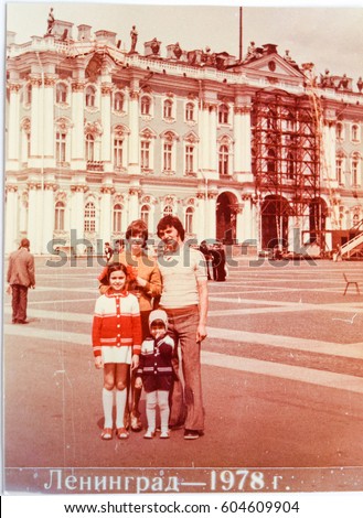 USSR, LENINGRAD - CIRCA 1978: Vintage photo of happy Soviet family Tsyukevich on walk on Palace square. Inscription on photo: "Leningrad, 1978"