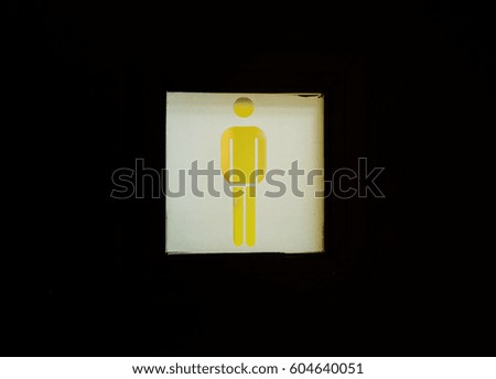  a man and toilet sign