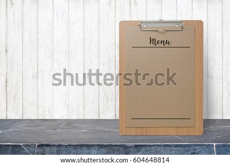 Blank Menu paper notepad on stone table top at grey old wooden wall,Template mock up for adding your design.