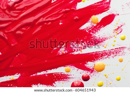 Nail polish bright texture free space. Smears of bloody varnish with yellow and pink drops on white background. Cosmetic, makeup, beauty, fashion concept