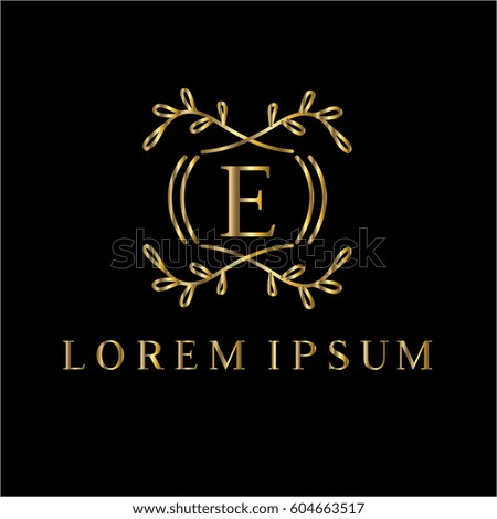 Golden vector monogram. Letter E logo design template