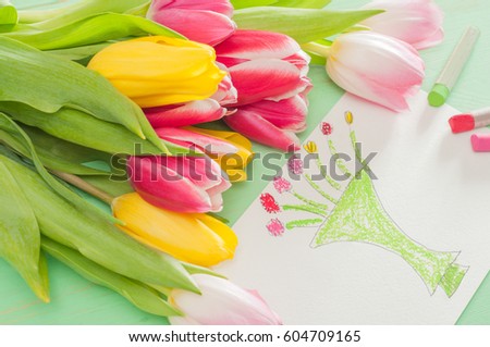 Bouquet of tulips  and kid's picture with vase and flowers for mother