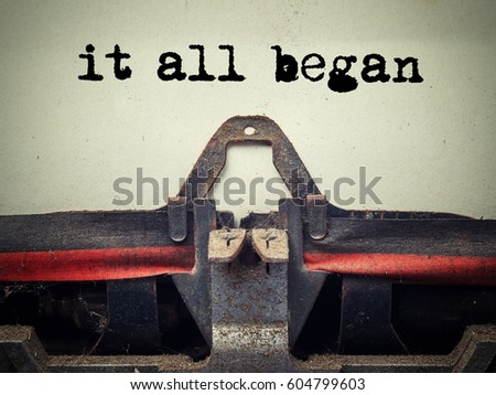 Close up of old typewriter covered with dust with it all began text Royalty-Free Stock Photo #604799603
