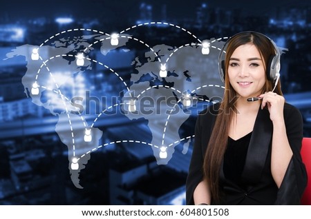 portrait of asian woman support phone operator or call center in headset sitting on red chair with global media connection on blurred night city background, customer support and service concept.
