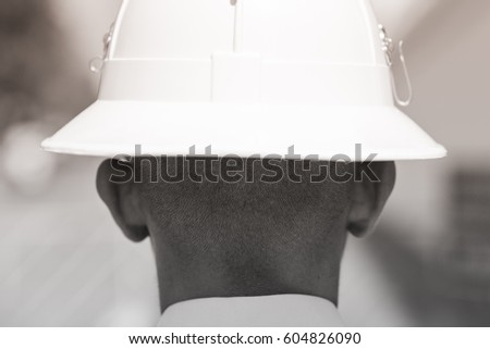 Shaved nape of a guardsman of the Royal Palace in Bangkok, black and white. Royal Thai Army soldier portrait, no face Royalty-Free Stock Photo #604826090