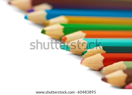 Several different colored pencils on a white background