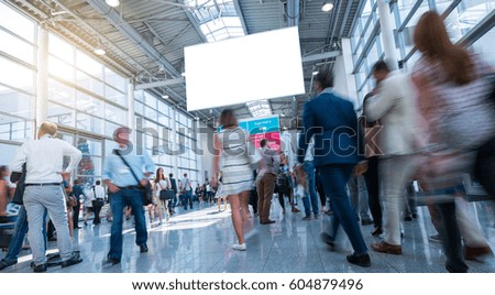 Business People Walking on trade fair Royalty-Free Stock Photo #604879496