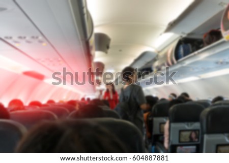 Blur background picture : passenger in cabin at airplane
