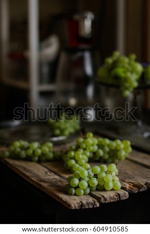 Grapes green fresh and juicy on a wooden surface
