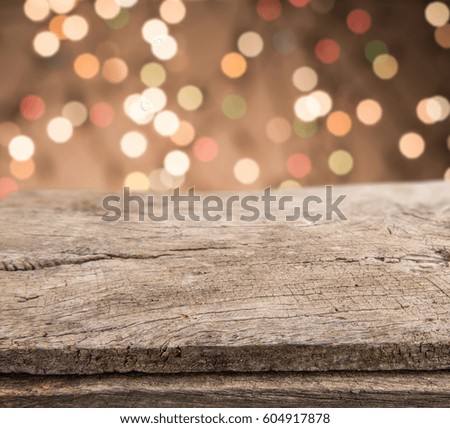 Empty wooden perspective platform with sparkling abstract rainbow blur bokeh used as template to mock up for display product