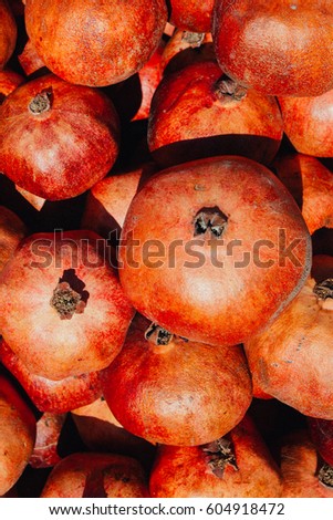 Fresh natural organic pomegranates on sale at local farmers market