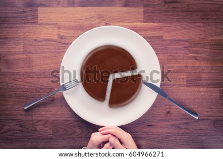 Market share - marketing business concept. Business visual metaphor - businessman with plate and pie chart with imitation of a chocolate cake.