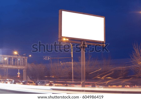 illuminated billboard in the street at night