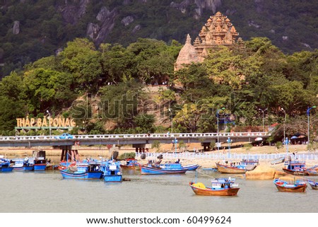 Old cham towers, bridge and boats in Nha Trang, Vietnam Royalty-Free Stock Photo #60499624