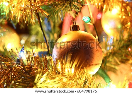 Colorful golden Christmas tree decorations composition. Bright pleasant mood.