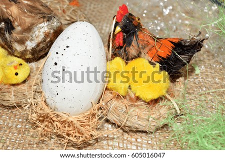decorated egg with chick inside a wicker basket