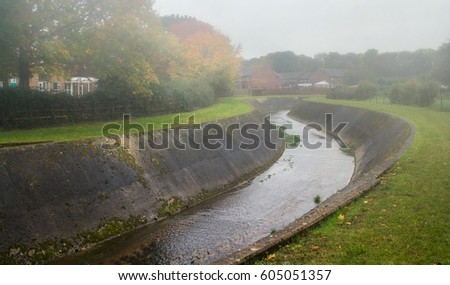 Alphin Brook in Alphington. Autumn weather - fog and damp. Exeter. Devon. England Royalty-Free Stock Photo #605051357
