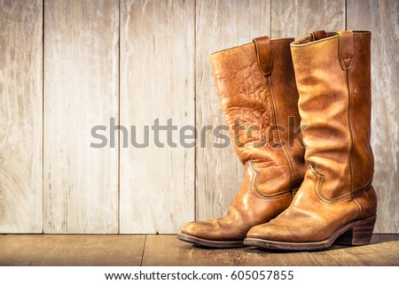Wild West retro leather cowboy boots. Vintage style filtered photo