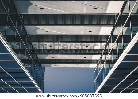 Urban Geometry, looking up to glass building. Modern architecture, glass and steel. . Abstract architectural design. Inspirational, artistic image.Minimal art. Architectural design. Building exterior.