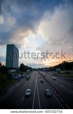 Motion picture in Kiev at night in the sunset. Kind of traffic on a busy street at sunset - the image has soft focus. Image of Kiev's evening traffic.