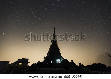 View of Phra Maha Dhatu Nabha Metaneedol and Phra Maha Dhatu Nabhapol Bhumisiri with milky way in galaxy, Chiangmai, Thailand.