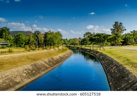 Water way canal for agriculture with blue sky background