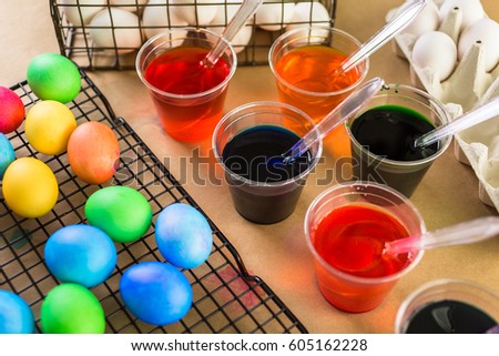 Painting Easter eggs with bright colors.