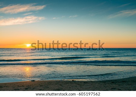 Sunset over the sea at Glenelg Beach, South Australia