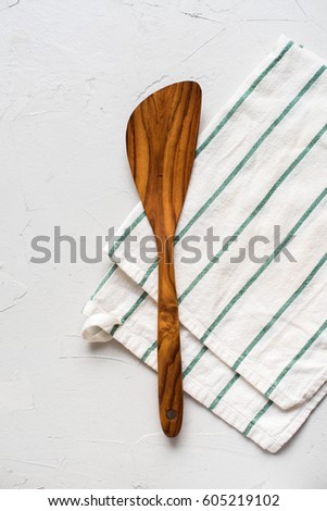 Perfect Table Setting with Wooden Spatula Striped White Napkin Top View Minimal Picture on Grey Concrete Vintage Background Kitchen Suppliment Copy Space