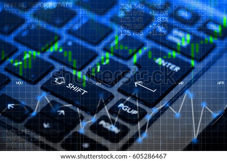 Stock exchange panel with notebook keyboard as background 