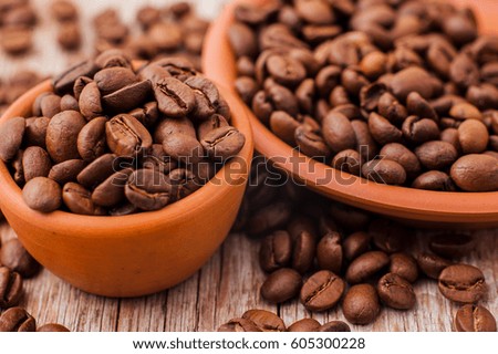 Coffee beans on textured surfaces.Fresh coffee beans