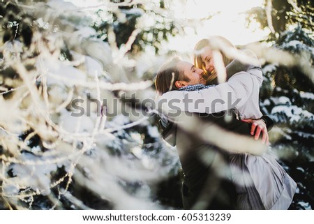 people, season, love and leisure concept - happy couple running over winter background
