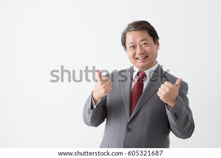 A businessman doing a good sign, middle aged man