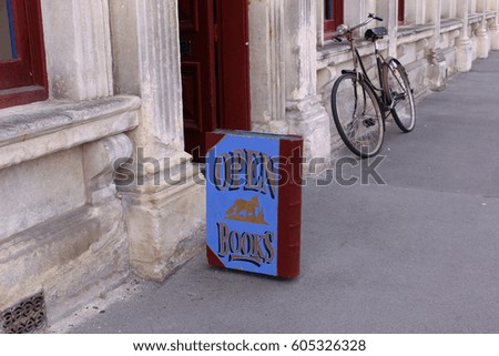 book store signboard and a bicycle on street