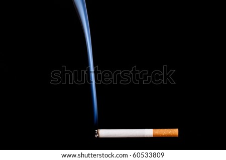 Smoking cigarette. Isolated on black. Closeup.