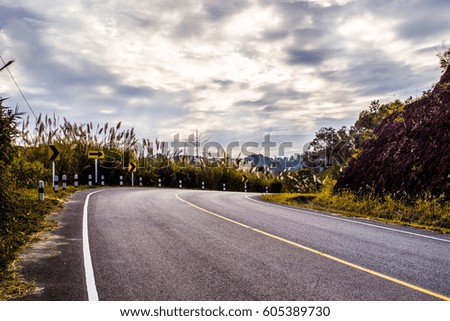 Curve road of highway No.1168 in Nan province of in Thailand in spring season.