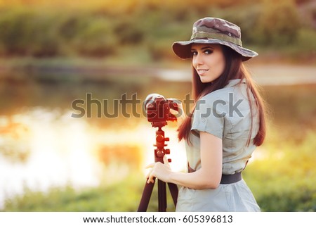 Landscape Photographer with Camera on a Tripod - Female artist taking travel photos in nature 

