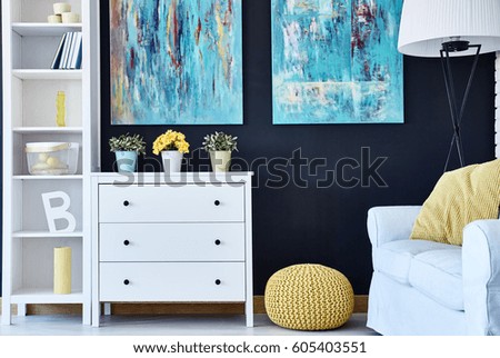 Modern room with navy wall and white furniture