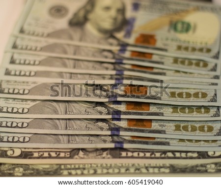 Dollar bills, US dollars. Deuce buck, five greenback, yard bills and money background. Cash Money. One Hundred Dollar Banknotes. Dollars banknotes on the ground isolated on white.