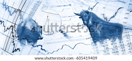 Bull, bear, charts and stock charts as symbols for the stock exchange Royalty-Free Stock Photo #605419409